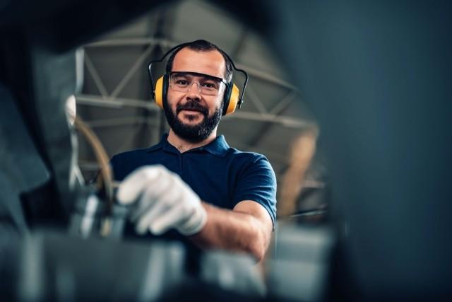 A man works in a European manufacturing facility